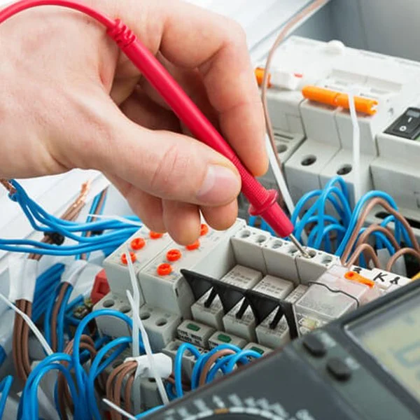 Electrician testing a switchboard